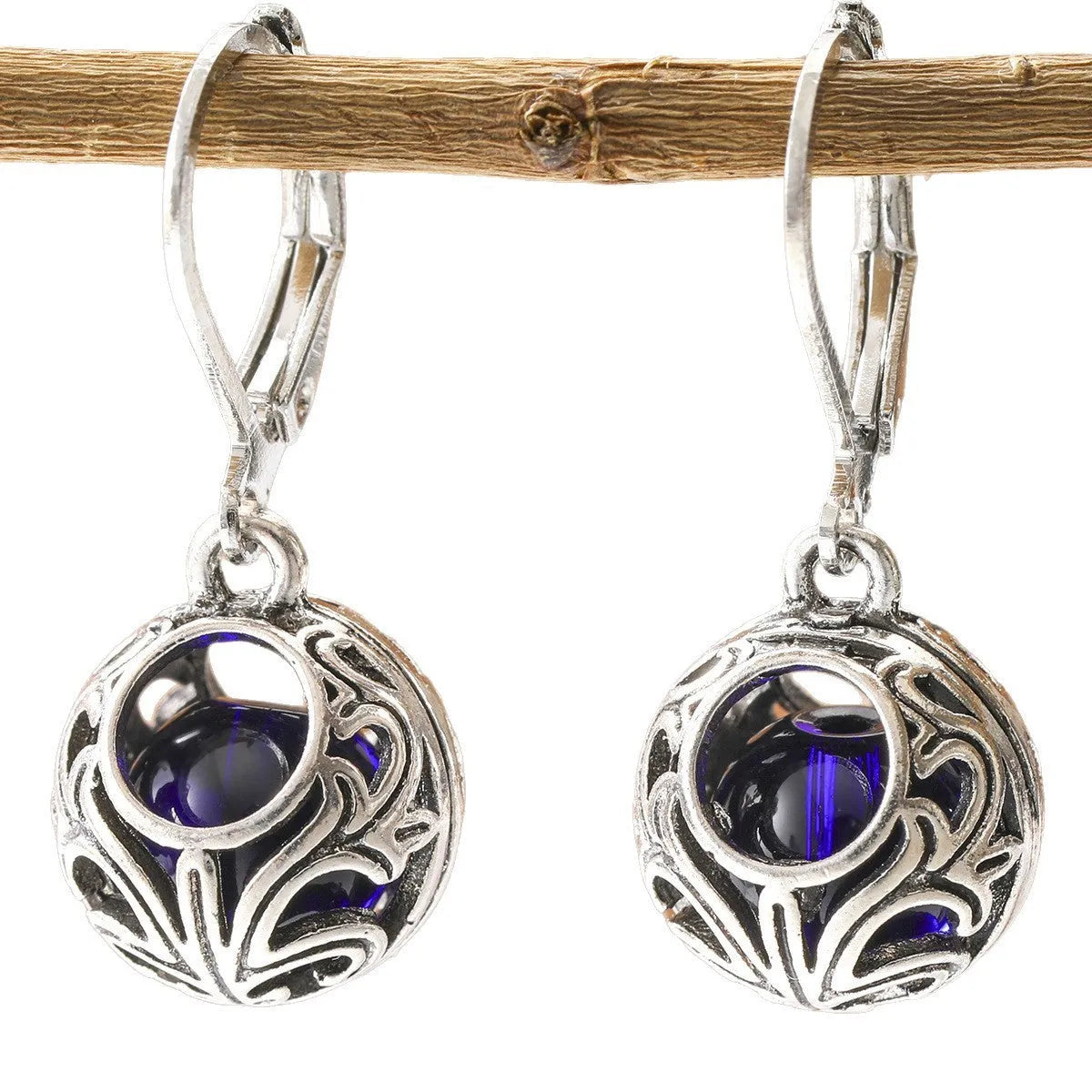 Vintage geometric silver tone pendant earrings with hollow blue gemstone setting
