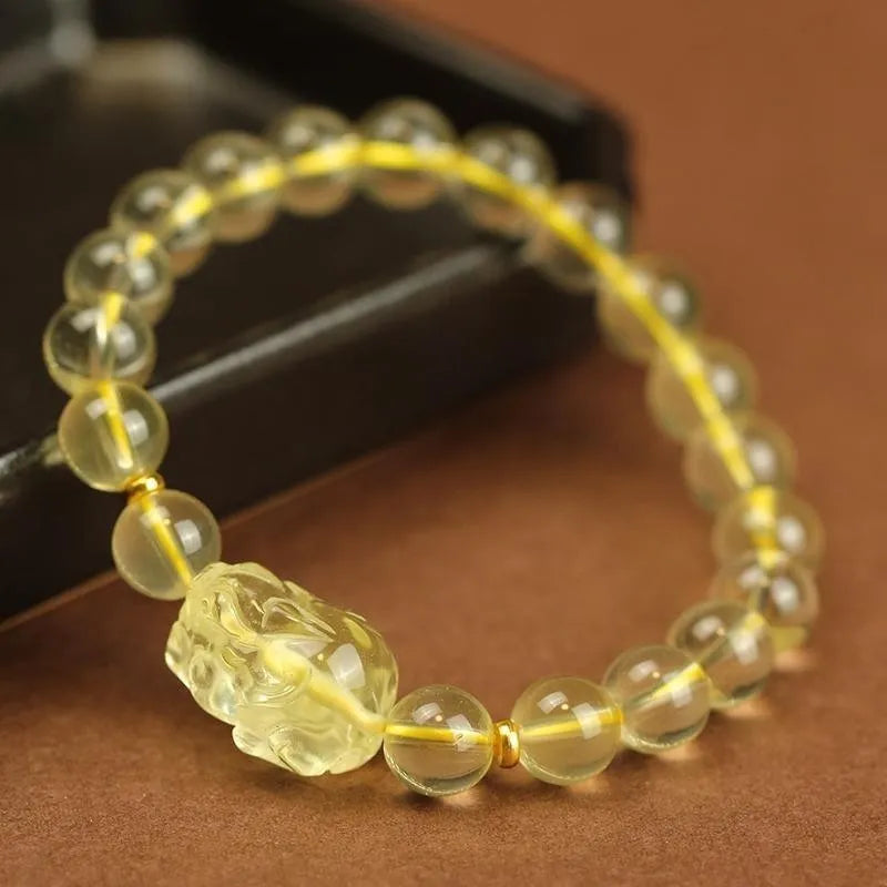 Yellow leather Pi Xiu bracelet with artificial crystal charm beads in Chinese simple style