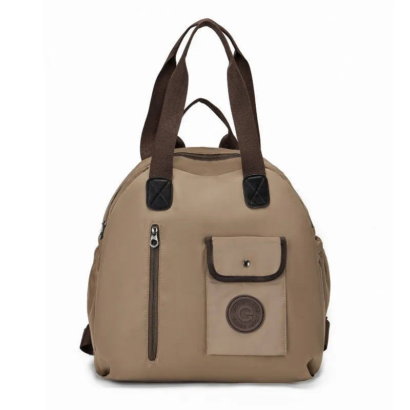 Women's lightweight nylon backpack in black, khaki, or green letter rabbit colours showing sandwich pocket design