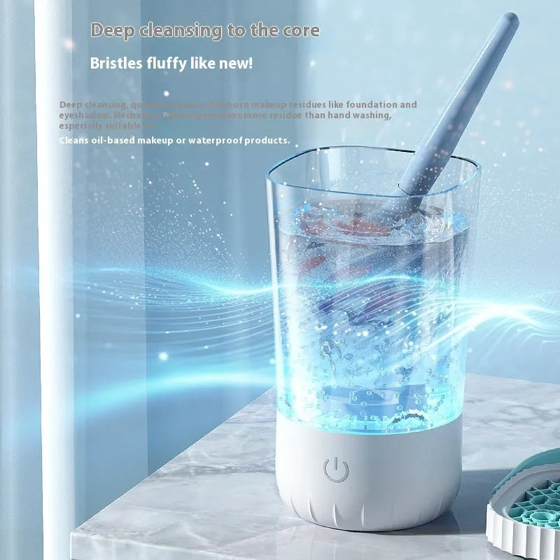 White plastic rechargeable makeup brush cleaning machine measuring 24cm with included data cable