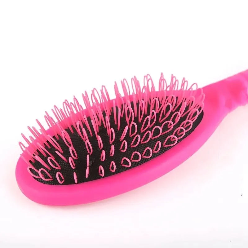 Black and pink ABS plastic hair extension comb with ring teeth measuring 22cm by 6cm