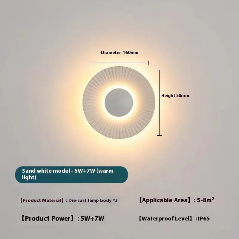 Round aluminium wall lamp with LED light source in multiple colour combinations for bedroom or living room