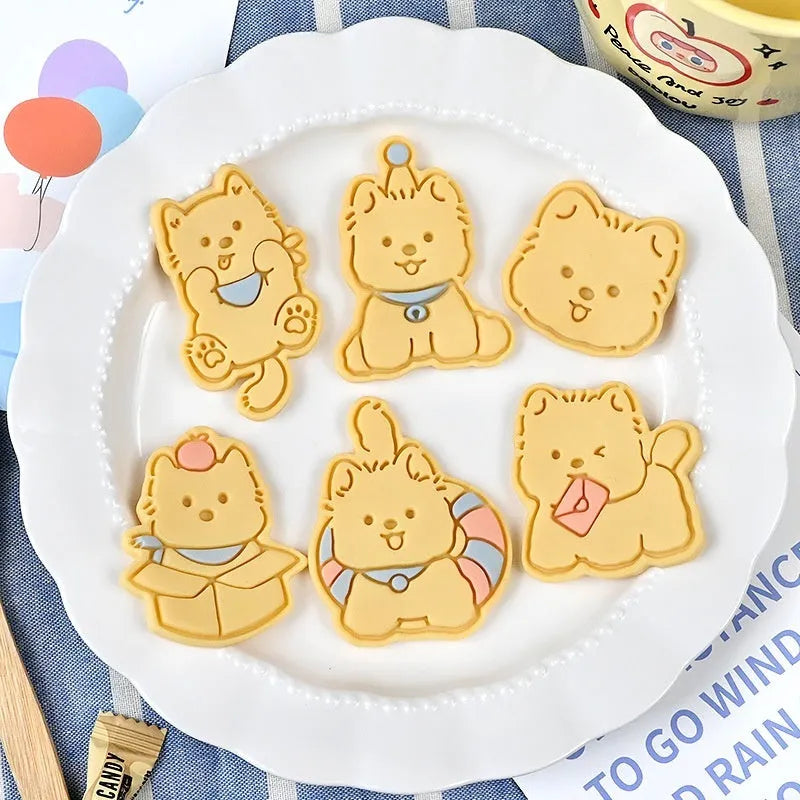 Plastic biscuit mould showing three-dimensional puppy head design with birthday hat for baking