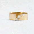 Gold electroplated zircon ring on finger showing shining finish and decorative detail