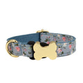 Nylon dog collar with printed grid pattern and a bone-shaped metal buckle in a selected colour.