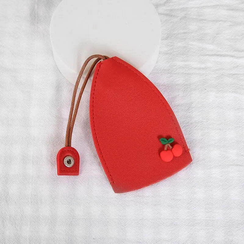 Cartoon pull-out key case in PU leather with colourful design, showing compact 14cm by 7.5cm dimensions