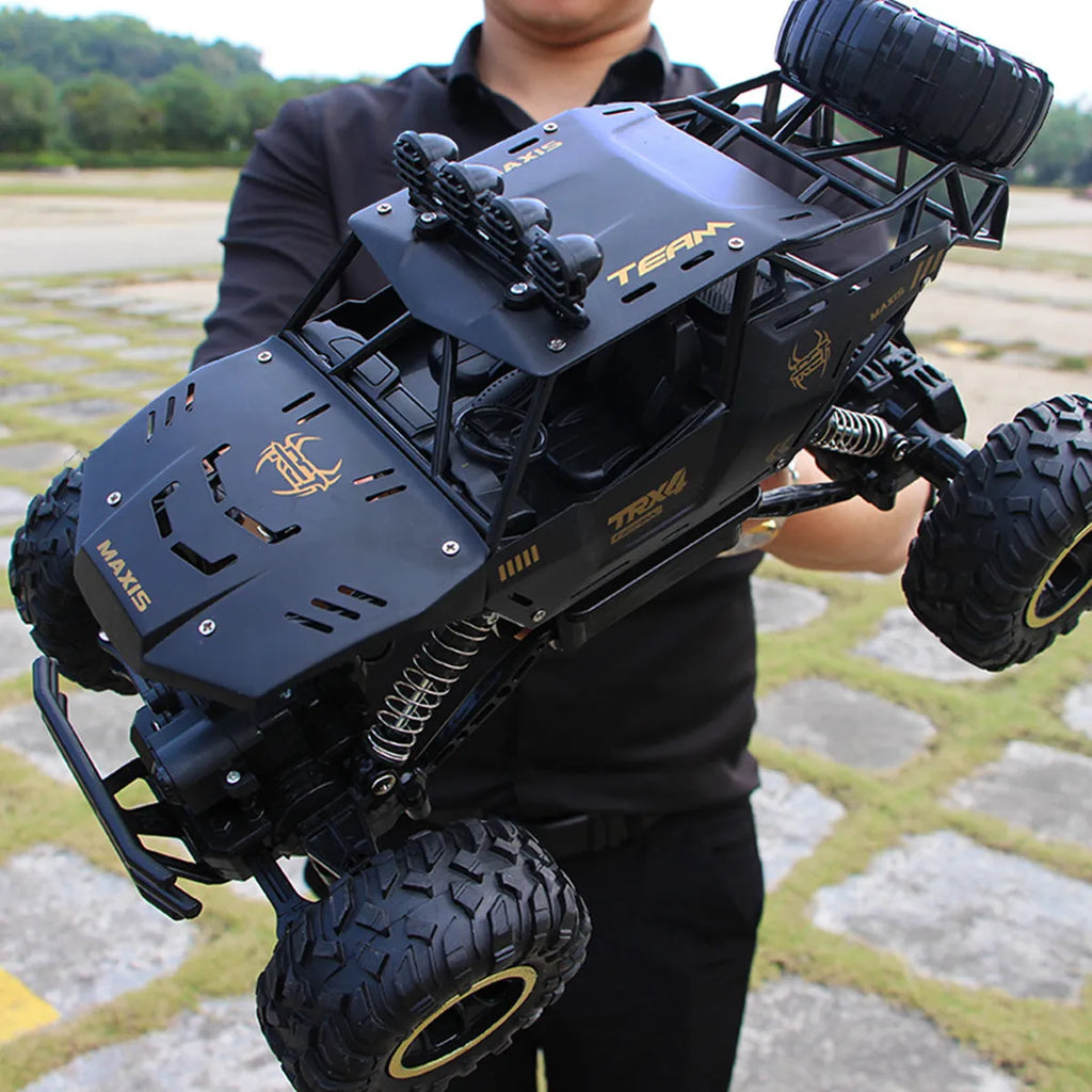 Large black 4WD off-road remote control climbing car with 2.4G wireless controller
