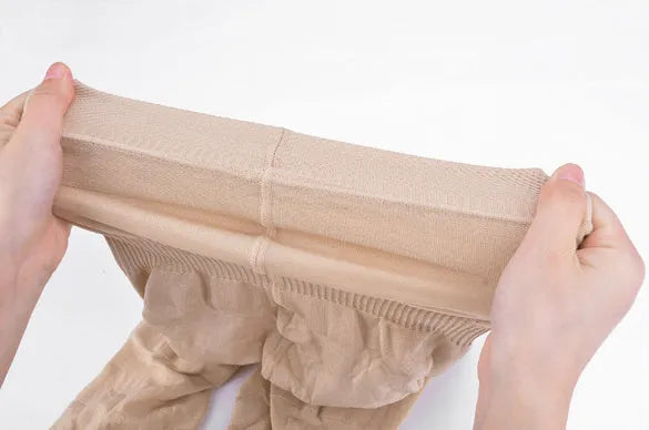 Black high-waisted seamless shapewear shorts for women laid flat.