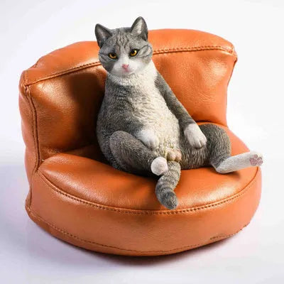 Lazy cat resin car dashboard ornament with sofa, 7.5cm tall