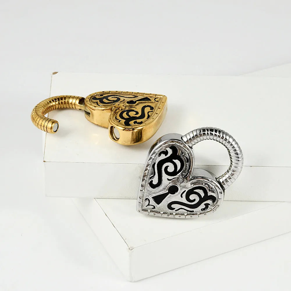 Women's stainless steel heart-shaped ear piercing studs in gold or steel colour options