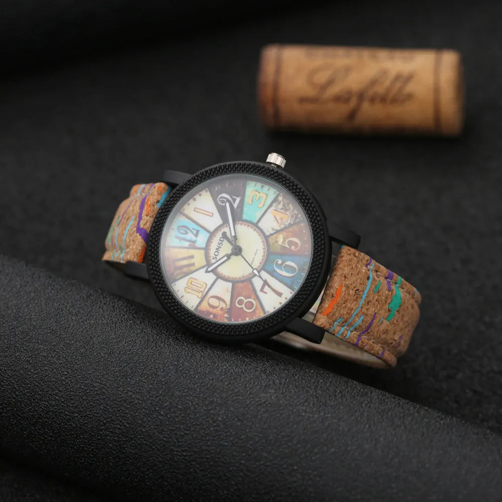 Vintage style women's leather strap quartz watch with round 37mm dial and stainless steel buckle.