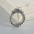 Pair of dragon motif alloy earrings with geometric hollow out design in antique silver colour