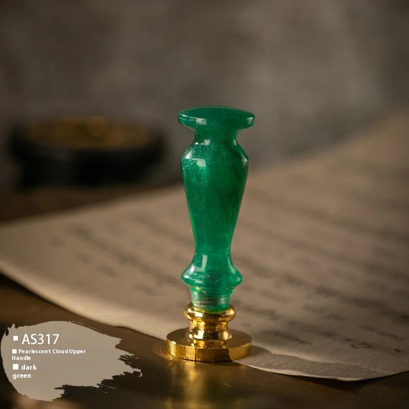 Wooden wax seal handle in a selection of different colour and decorative finishes.