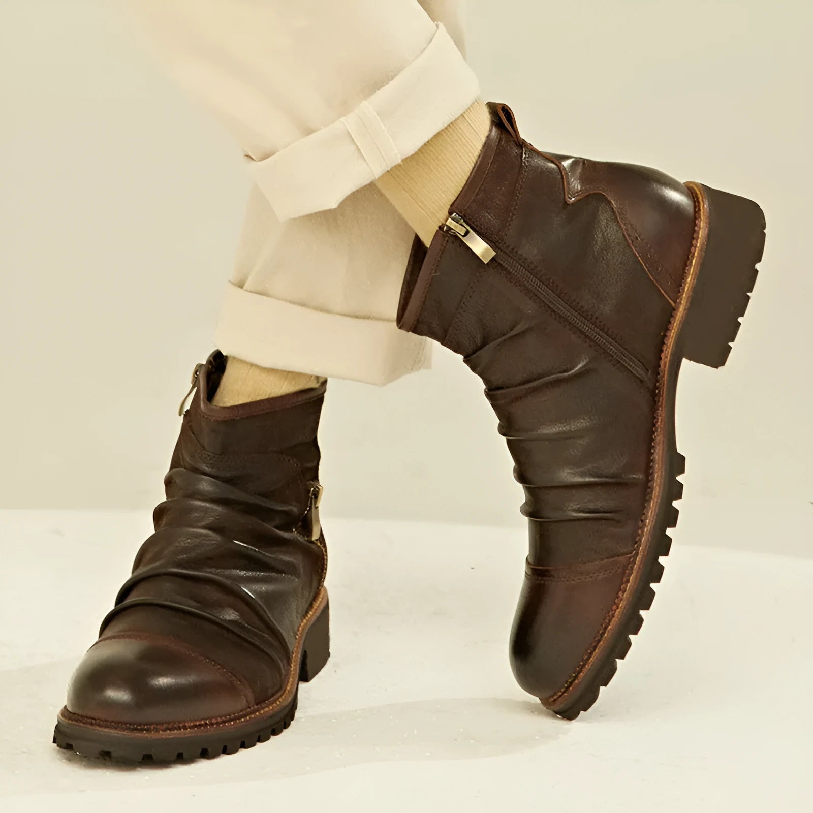 Men's black synthetic leather cowboy boots with a side zipper and a mid-height shaft on a white background.