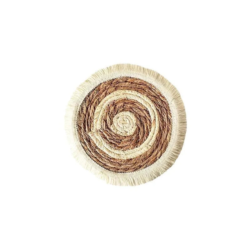 Round papyrus straw placemat with decorative tassels in modern solid colour design