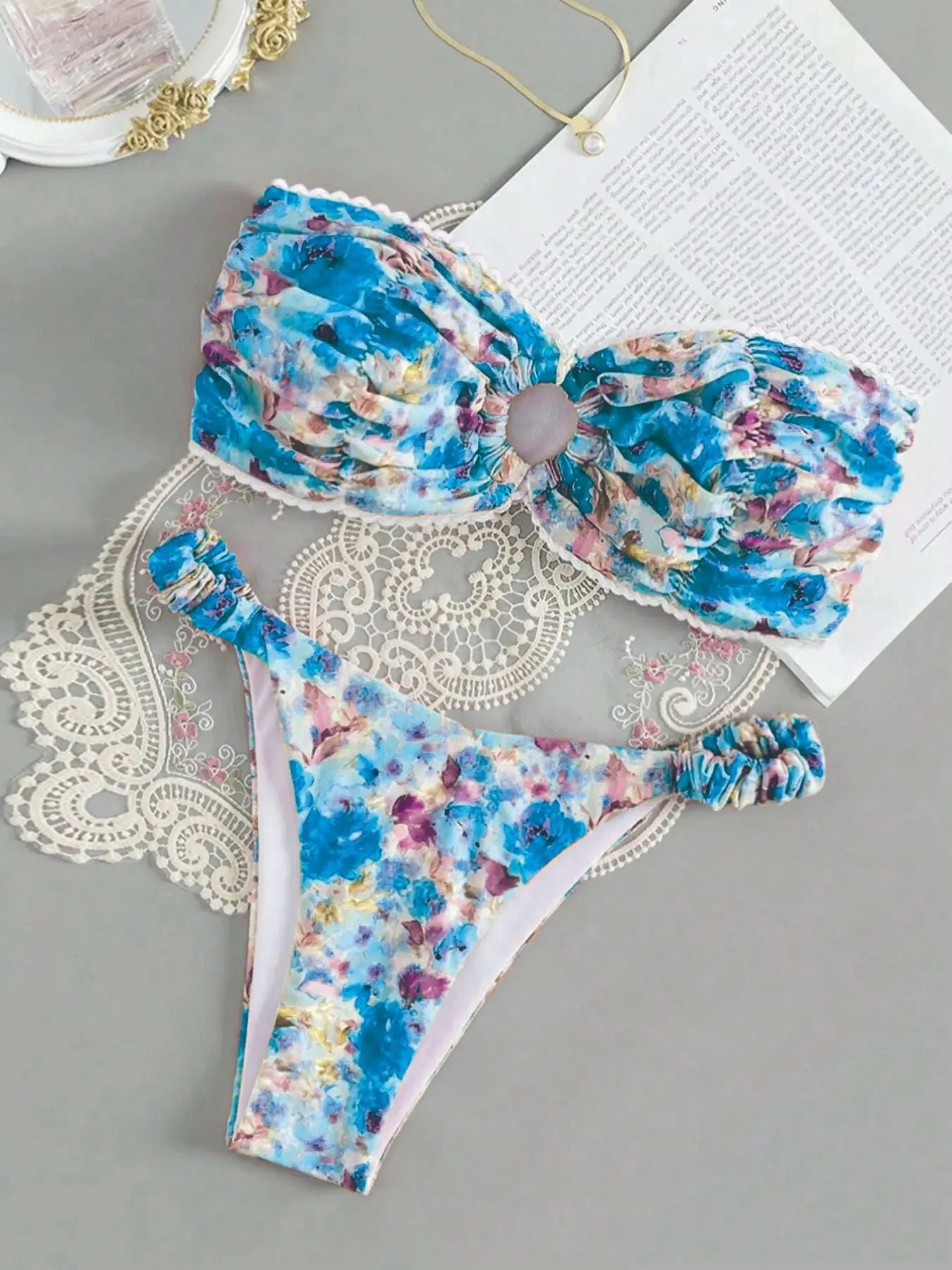 Printed tube top bikini set with lace detail and floral pattern in blue colour