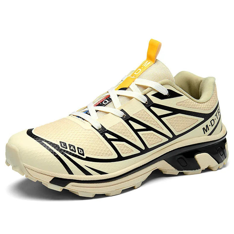 Low-top hiking shoes in khaki with rubber soles and front lace-up closure.