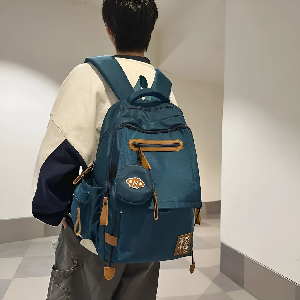 Large black nylon school backpack with curved shoulder straps for secondary school students.
