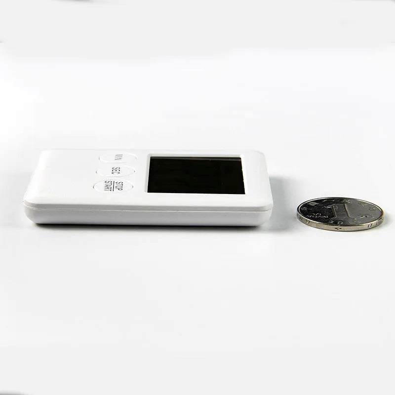 Black and white kitchen timer with digital display and magnetic back