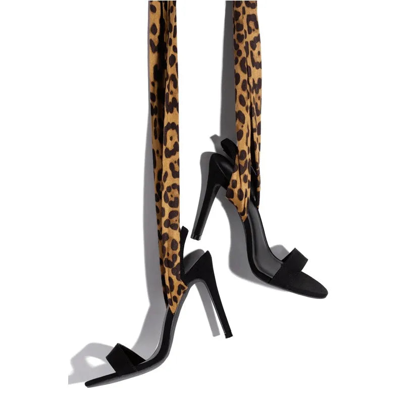 Light brown leopard print women's high heel sandals with cross straps and a thin high heel