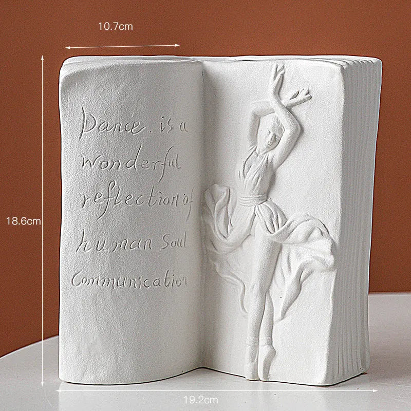 Ceramic book stand in a modern simple style with a glazed decorative pattern, holding a book upright.