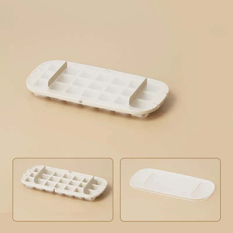 Blue high-capacity ice cube tray with integrated storage for an ice shovel.