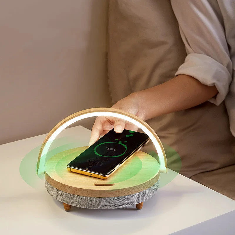 Wireless charging LED night light with Bluetooth speaker and phone holder in marble pattern or wood grain finish