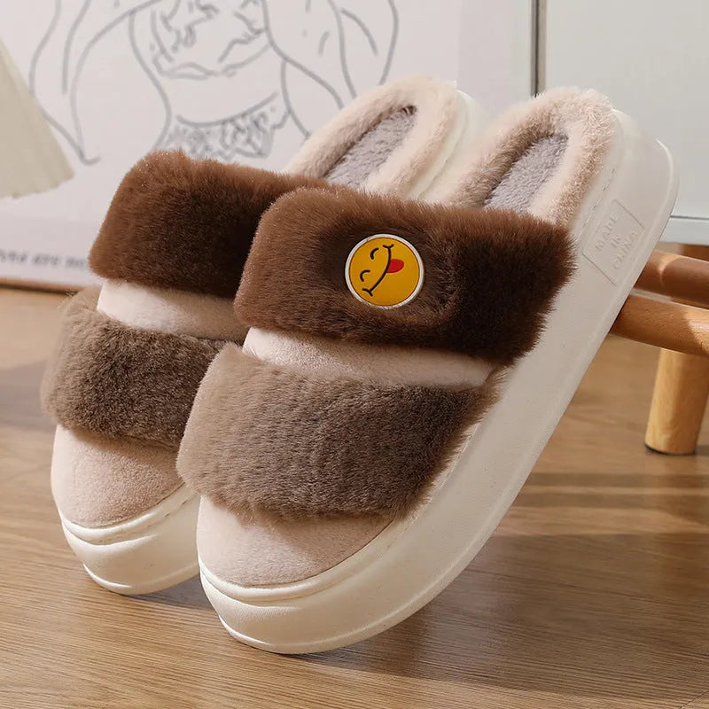 Cartoon-style pink and green thermal plush slippers with cashmere lining.