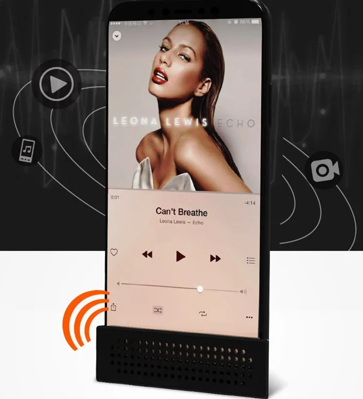 Mini mobile phone amplifier bracket on desktop enhancing smartphone sound in black, blue, pink or orange