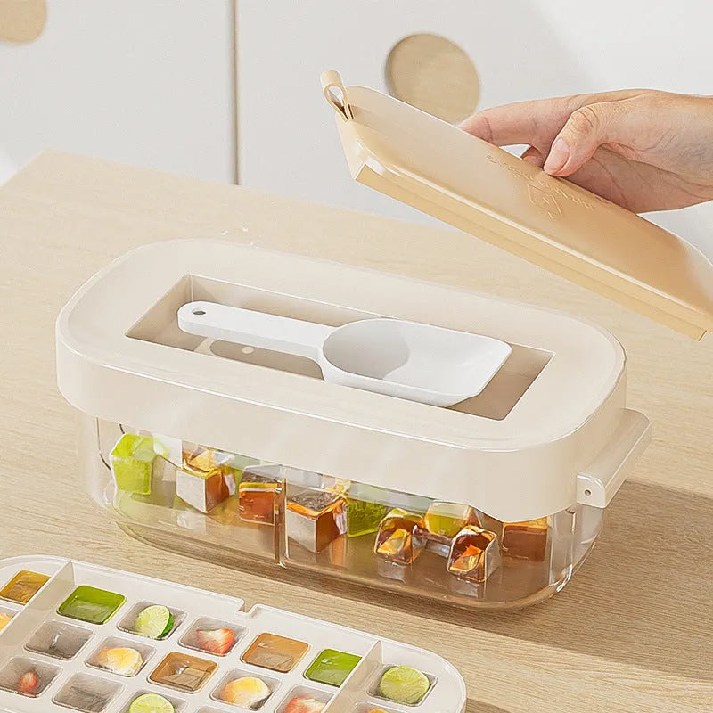Blue high-capacity ice cube tray with integrated storage for an ice shovel.