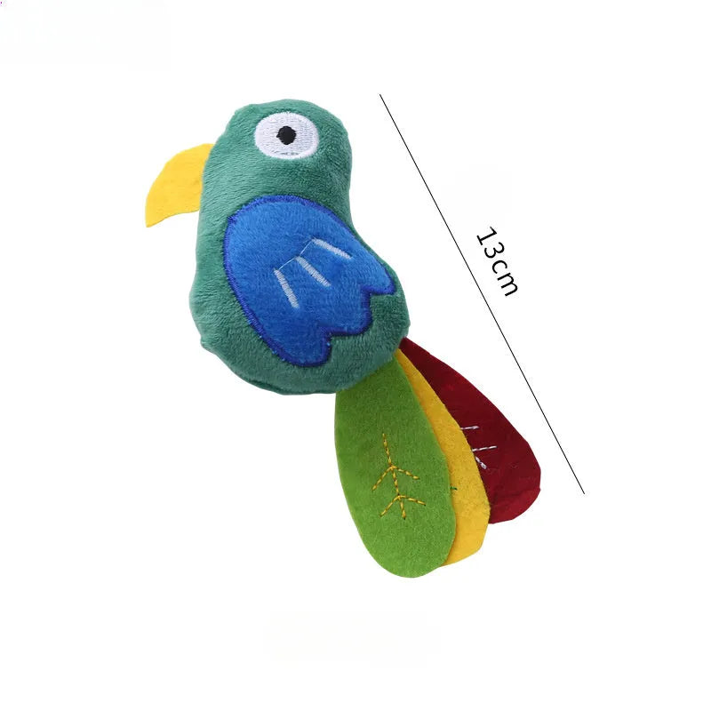 Soft plush cat toy shaped like a cow or parrot, filled with catnip, on a neutral background.