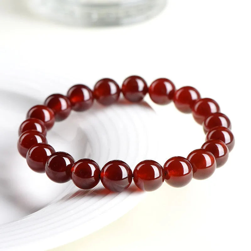 Natural orange red garnet crystal ball bracelet with Ruyi symbols in retro unisex design