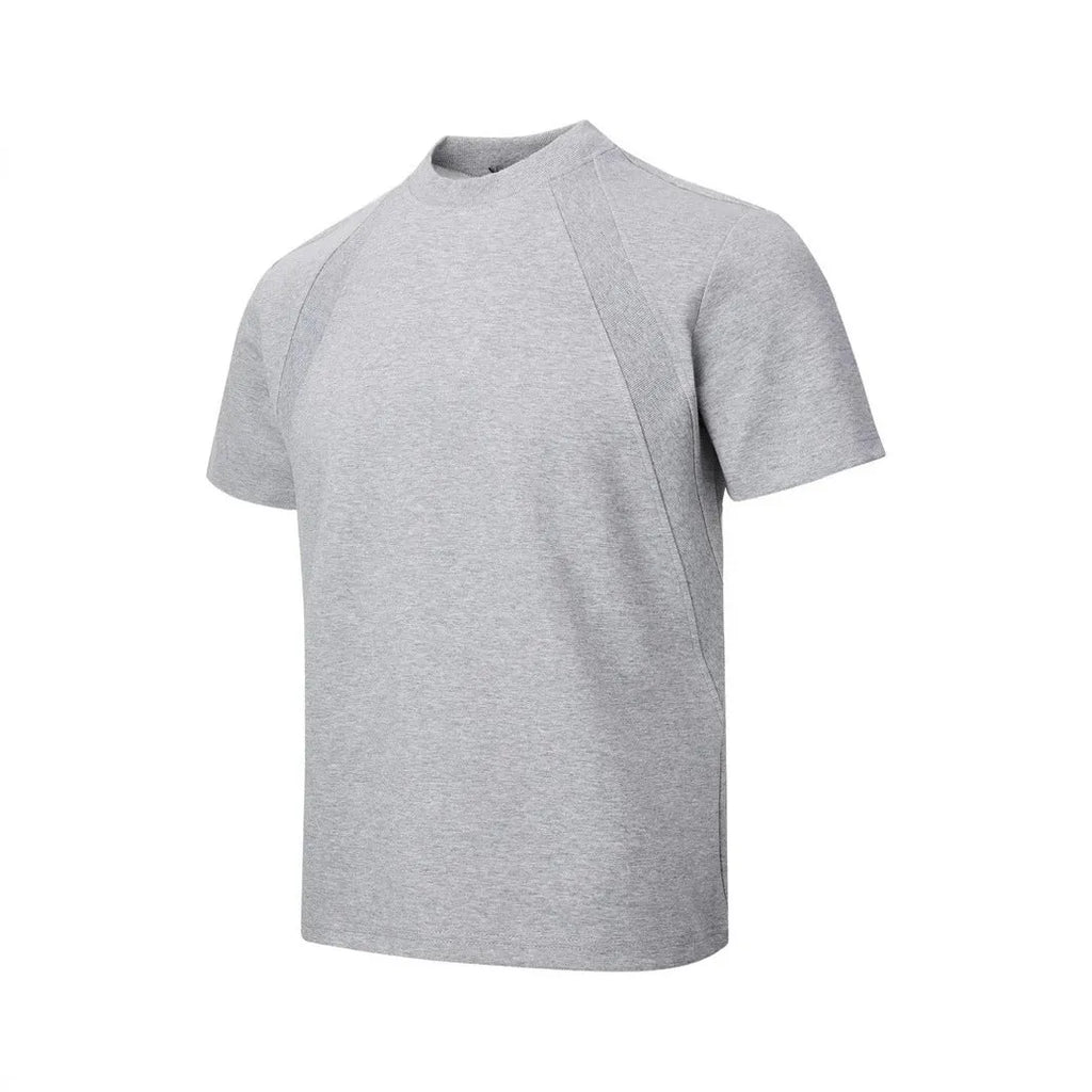 Man wearing a black loose-fit short sleeve top with visible air layer stitching texture.