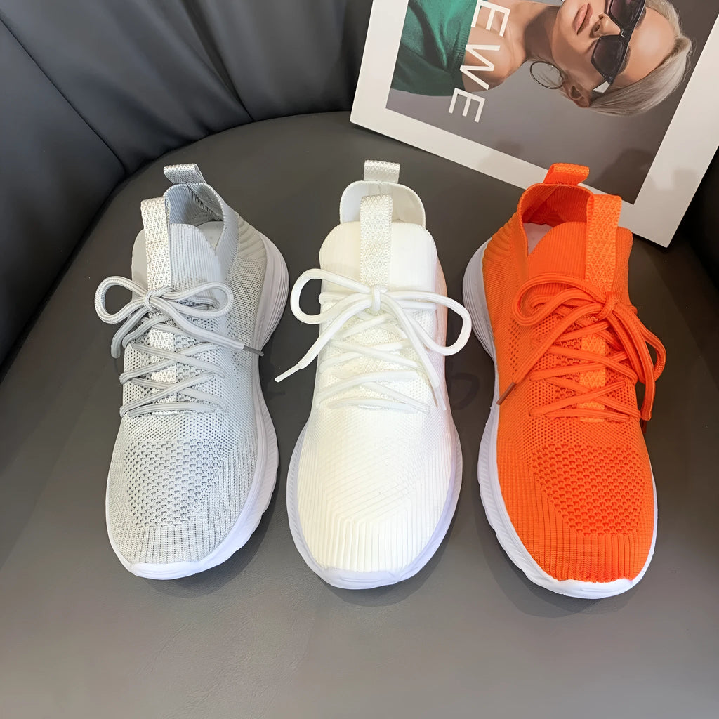 Women's low top flyknit running shoes with mesh lining and rubber sole in solid colour