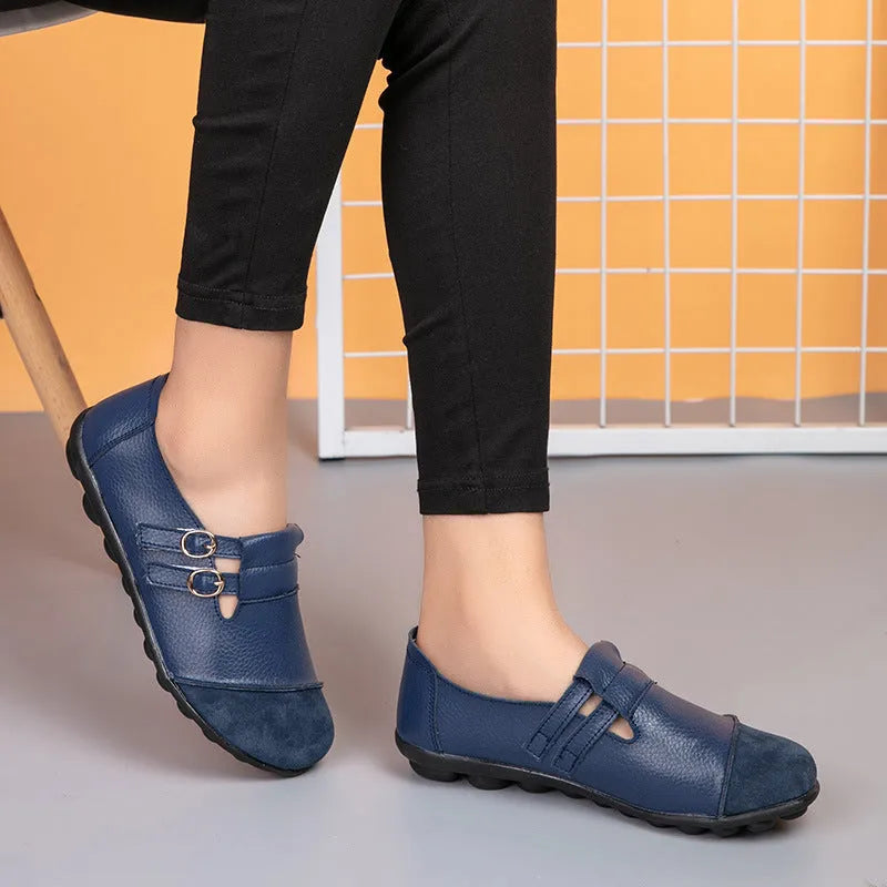 Women's casual round-toe flat shoes with a black Velcro strap on a cow leather upper.