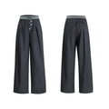 Men's grey straight-leg high-waisted trousers with a button-fly opening on a neutral background.