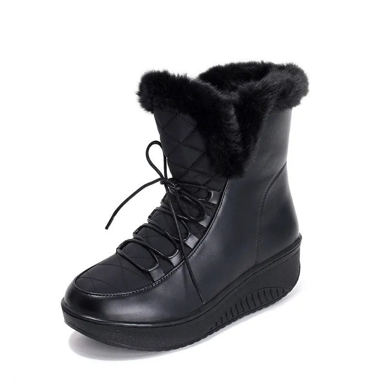 Black women's lace-up winter ankle boots with a platform sole on a white background