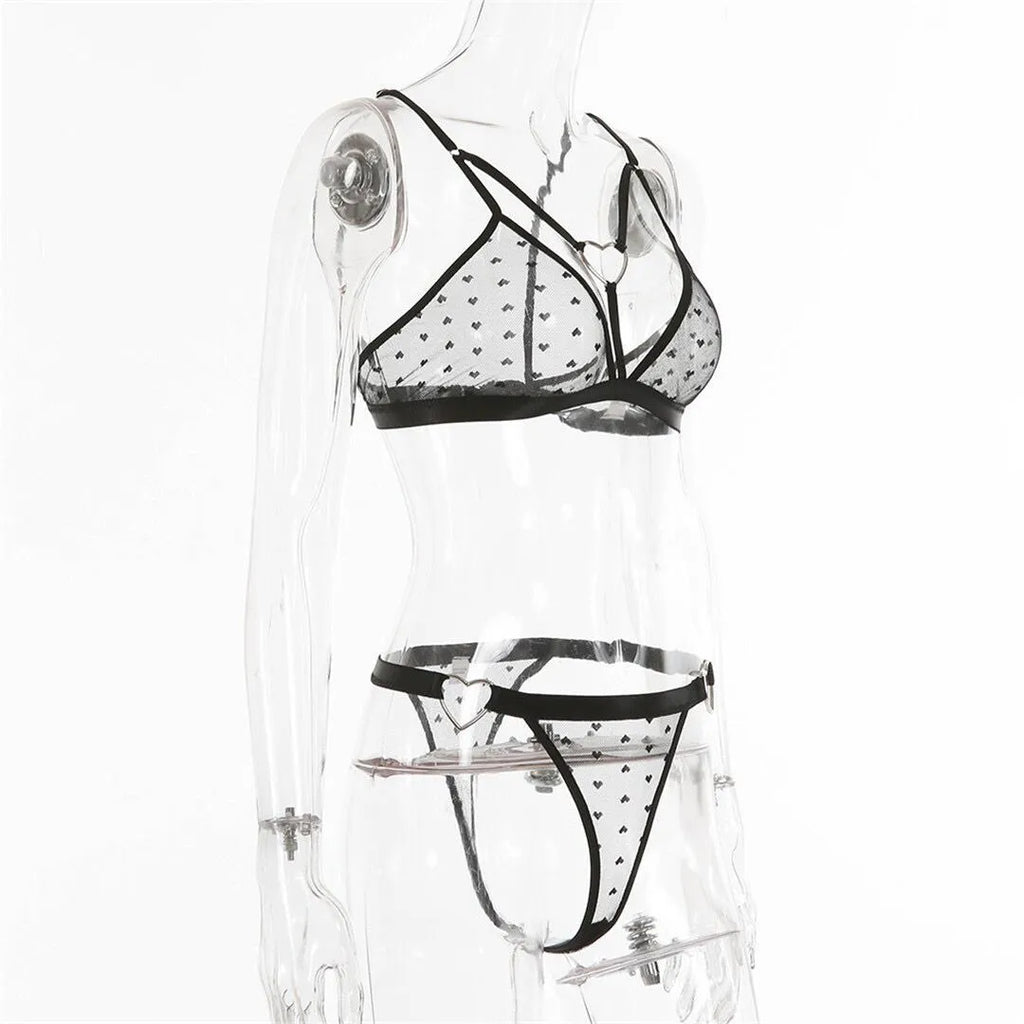 Ladies spandex two-piece set in black showing mesh three-point design with top and trousers
