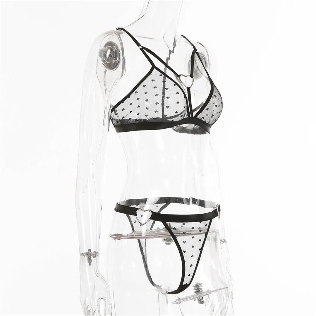 Ladies spandex two-piece set in black showing mesh three-point design with top and trousers