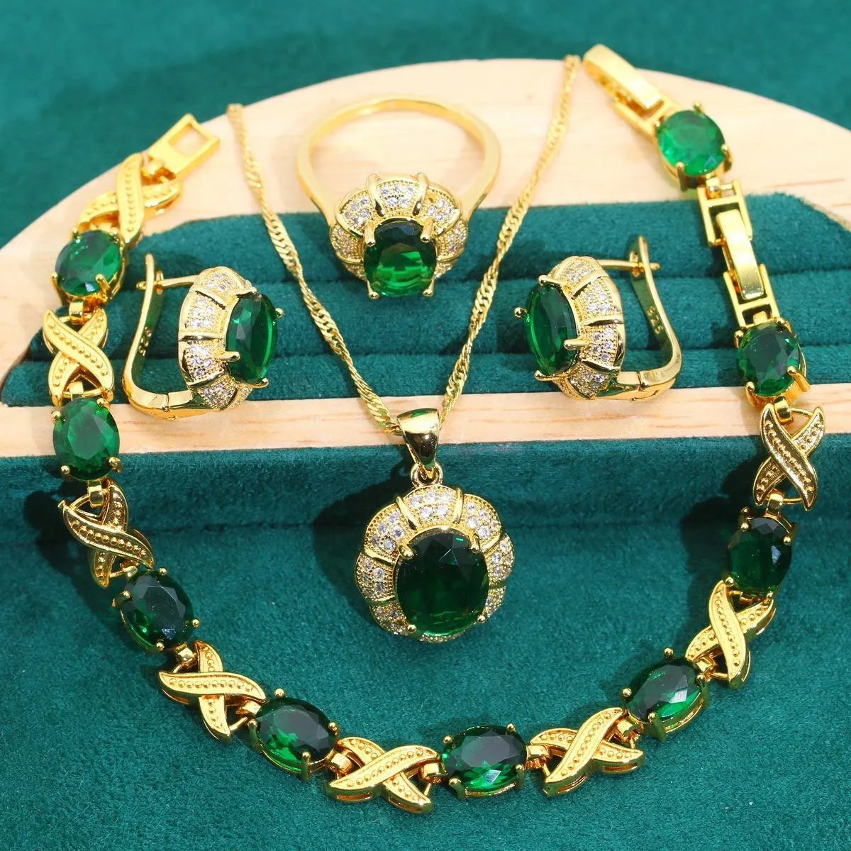 Gold plated jewellery set with multi-colour cubic zirconia stones, featuring a necklace, earrings, a ring, and a bracelet.