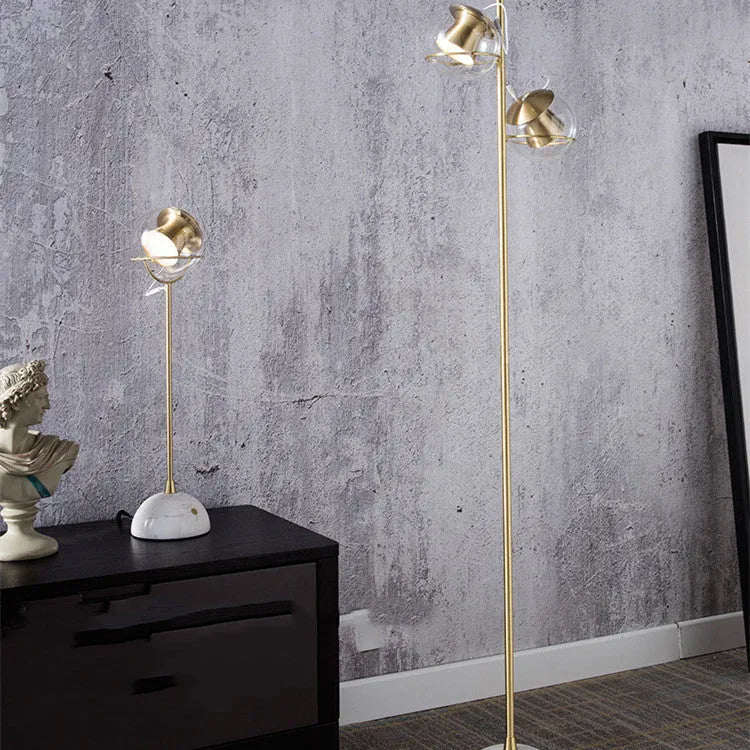 White desk lamp with glass shade and touch-sensitive dimmer switch.
