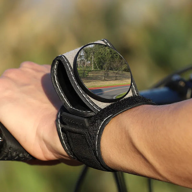 Black nylon wrist-mounted cycling rear-view mirror with adjustable strap