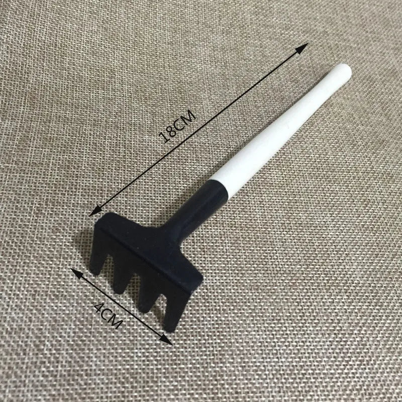 Succulent gardening tool set with plastic watering can, mini shovel, tweezers, and small brush arranged for indoor plant care