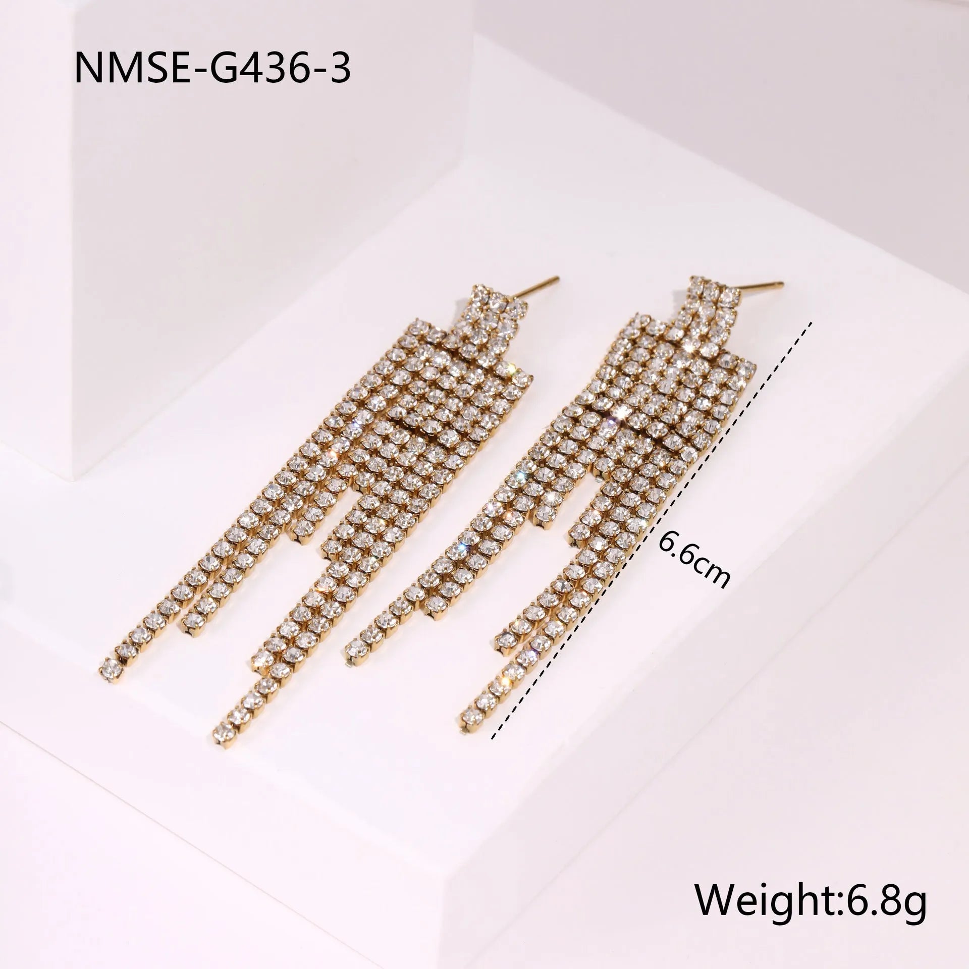 Gold plated geometric earrings for women featuring heart and star shapes with a diamond tassel.