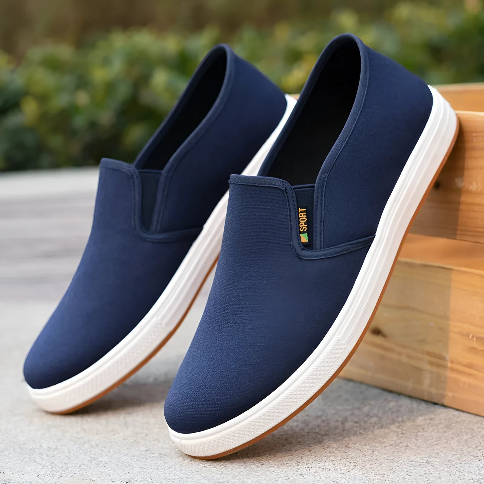 Men's black slip-on canvas shoes with round toe and composite sole