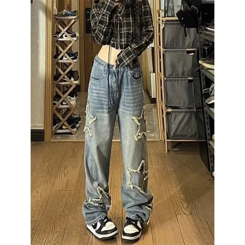 Blue high-waisted wide-leg denim trousers with straight-leg design on hanger