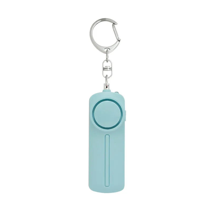 Compact pink personal safety alarm showing 130 dB siren specification and six-hour duration.