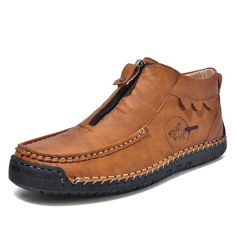 Men's black slip-on loafers with round toe and sewing thread detail on a rubber sole.