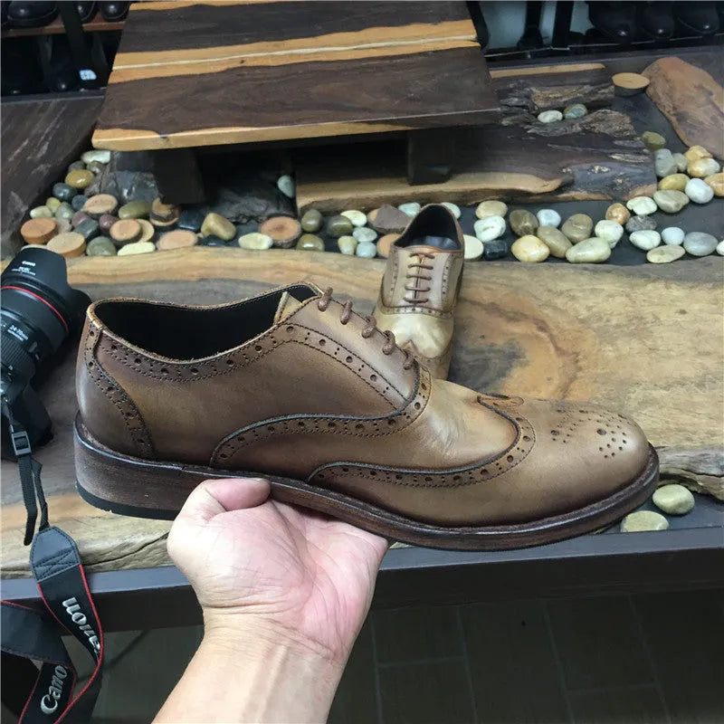 Men's light brown leather shoes with engraved distressed detailing and lace-up closure