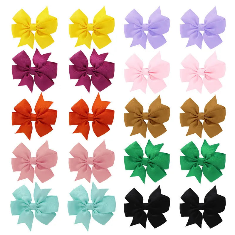 Assortment of 20 colourful handmade grosgrain ribbon hair bows with alligator clips for toddlers.